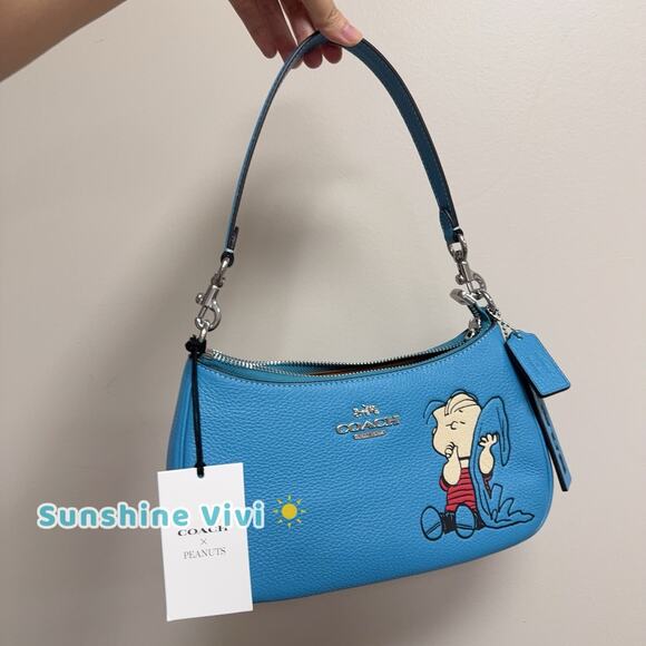 NWT Coach CBM31 X Peanuts Teri Shoulder Bag Linus Pebble Leather Parrot Blue - Picture 1 of 5